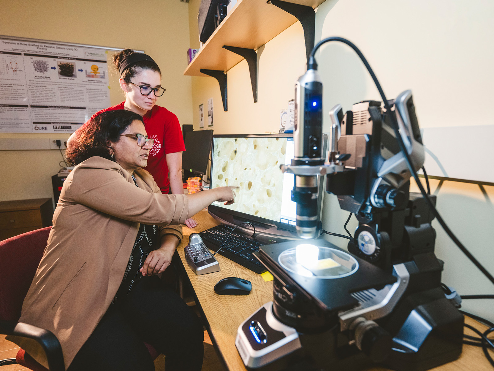 Anamika Prasad and a student working on a 3D print