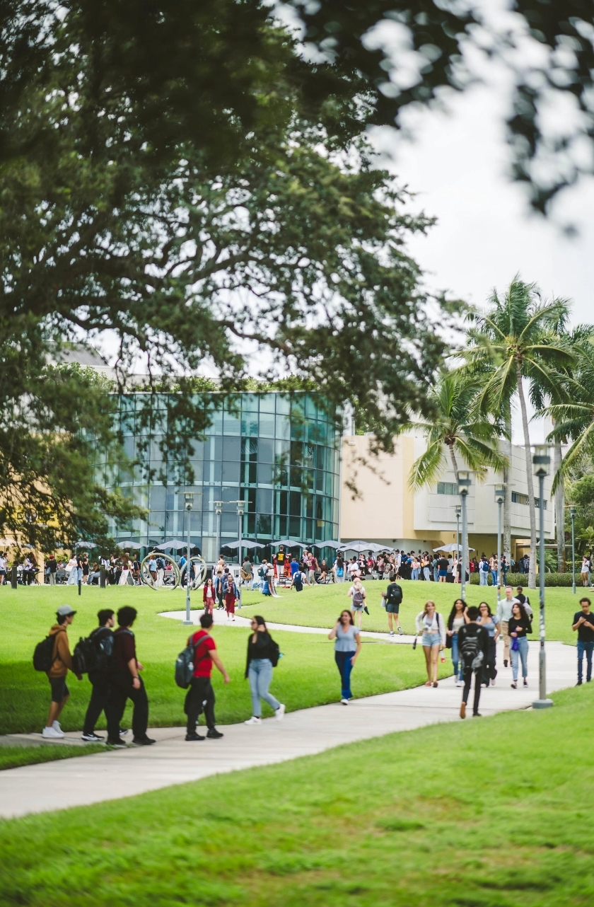 FIU students walking through the GC Lawns