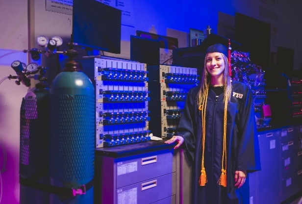 FIU student dressed in her cap and gown.